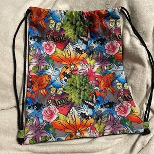Bold and vibrant tattoo-themed drawstring backpack